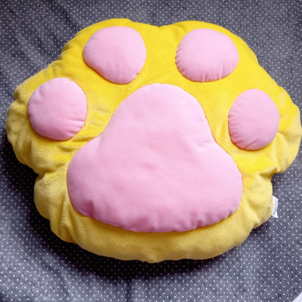 Yellow paw cushion